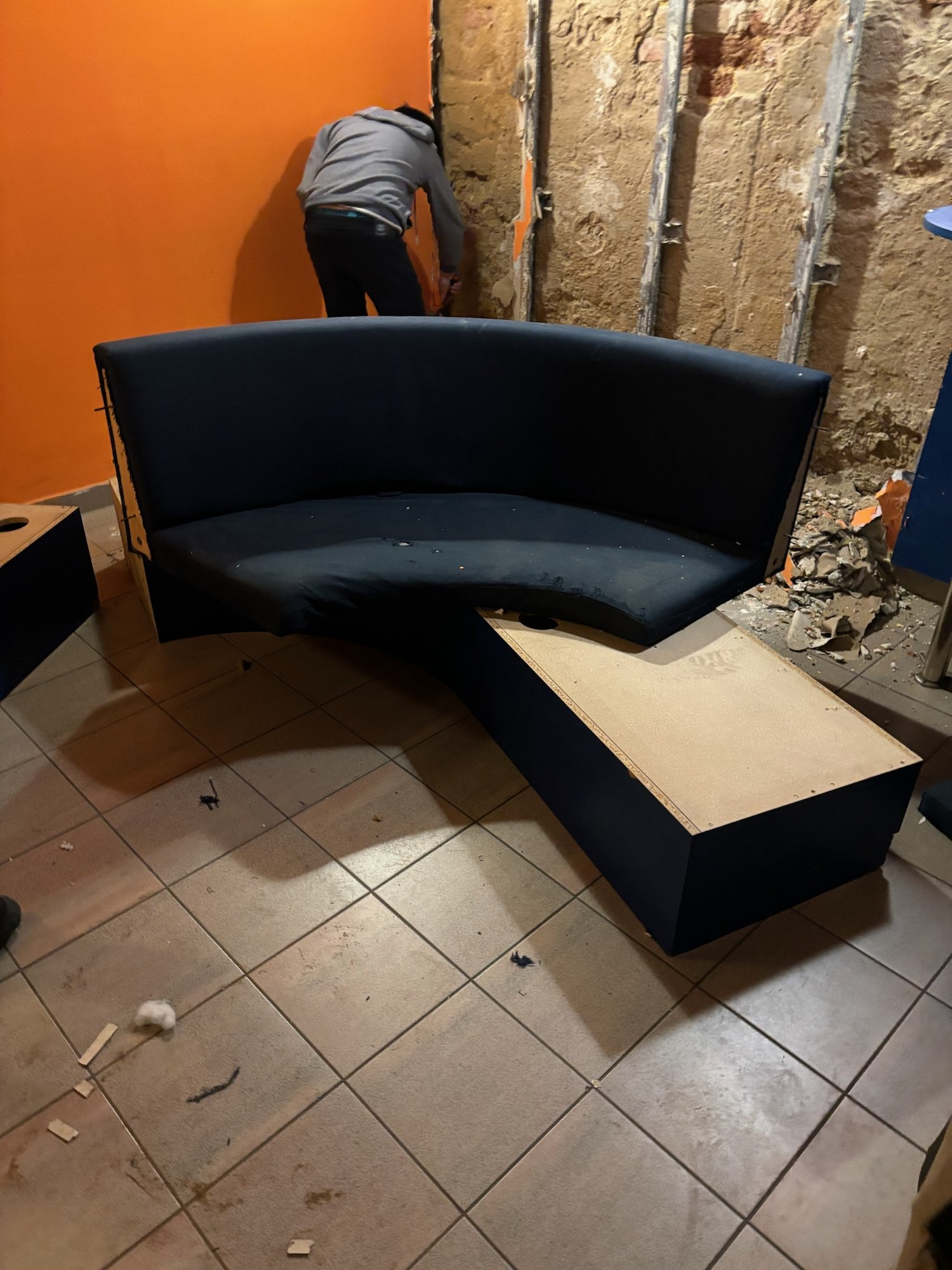 A bare wall in the bar area before the works