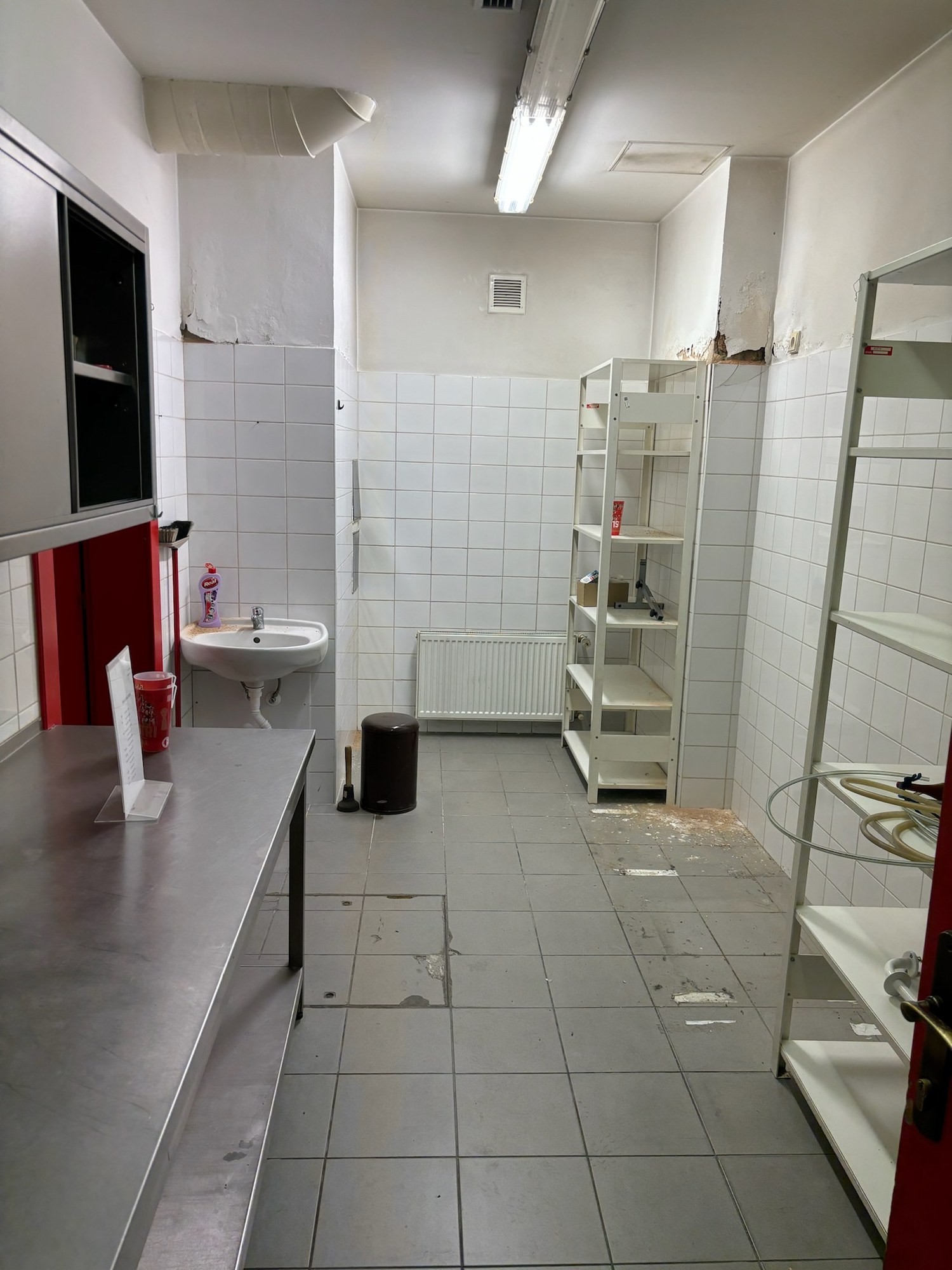 The old kitchenette with white tiles