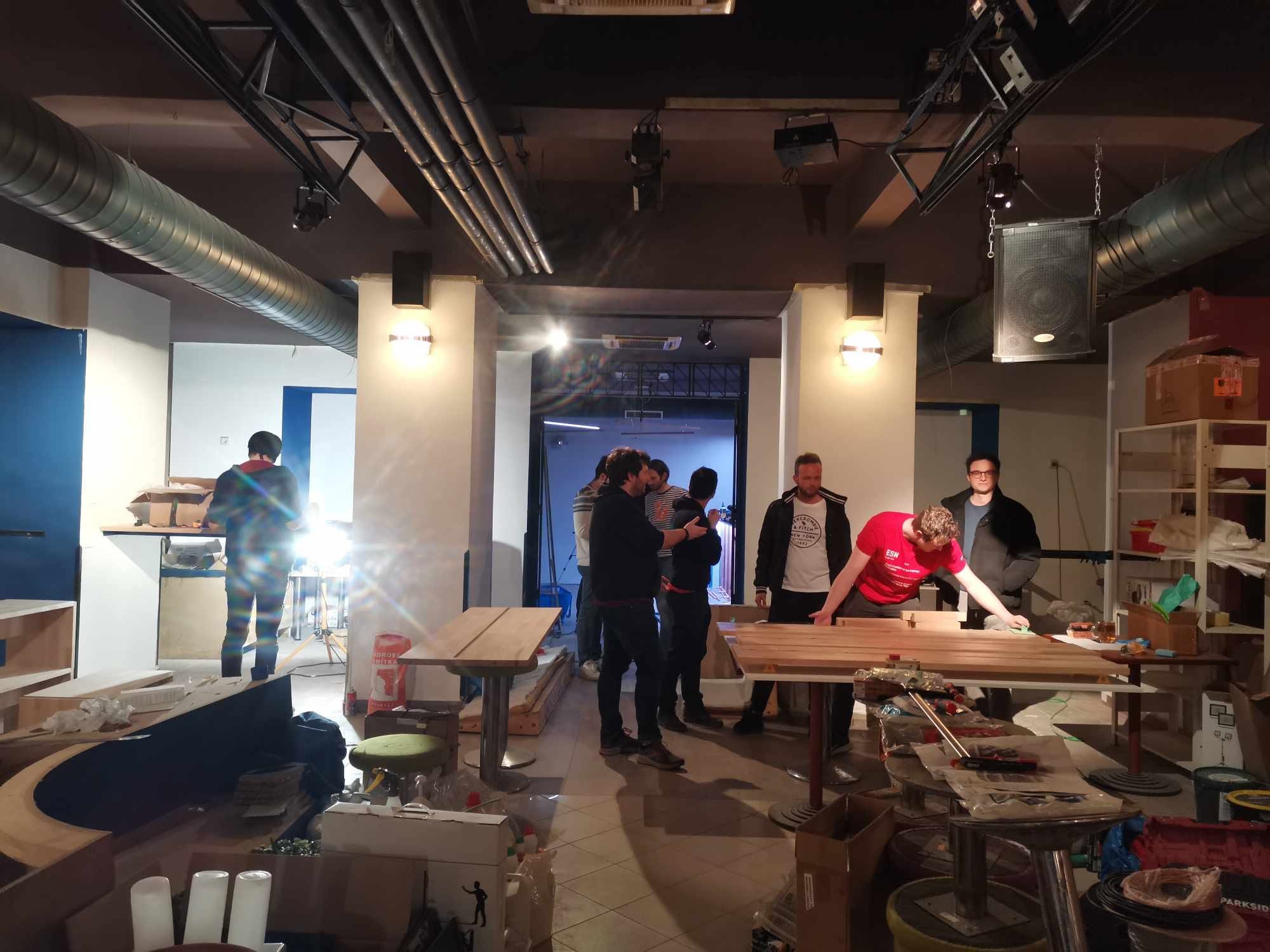 The half-built basement during the renovation, a group of people working inside