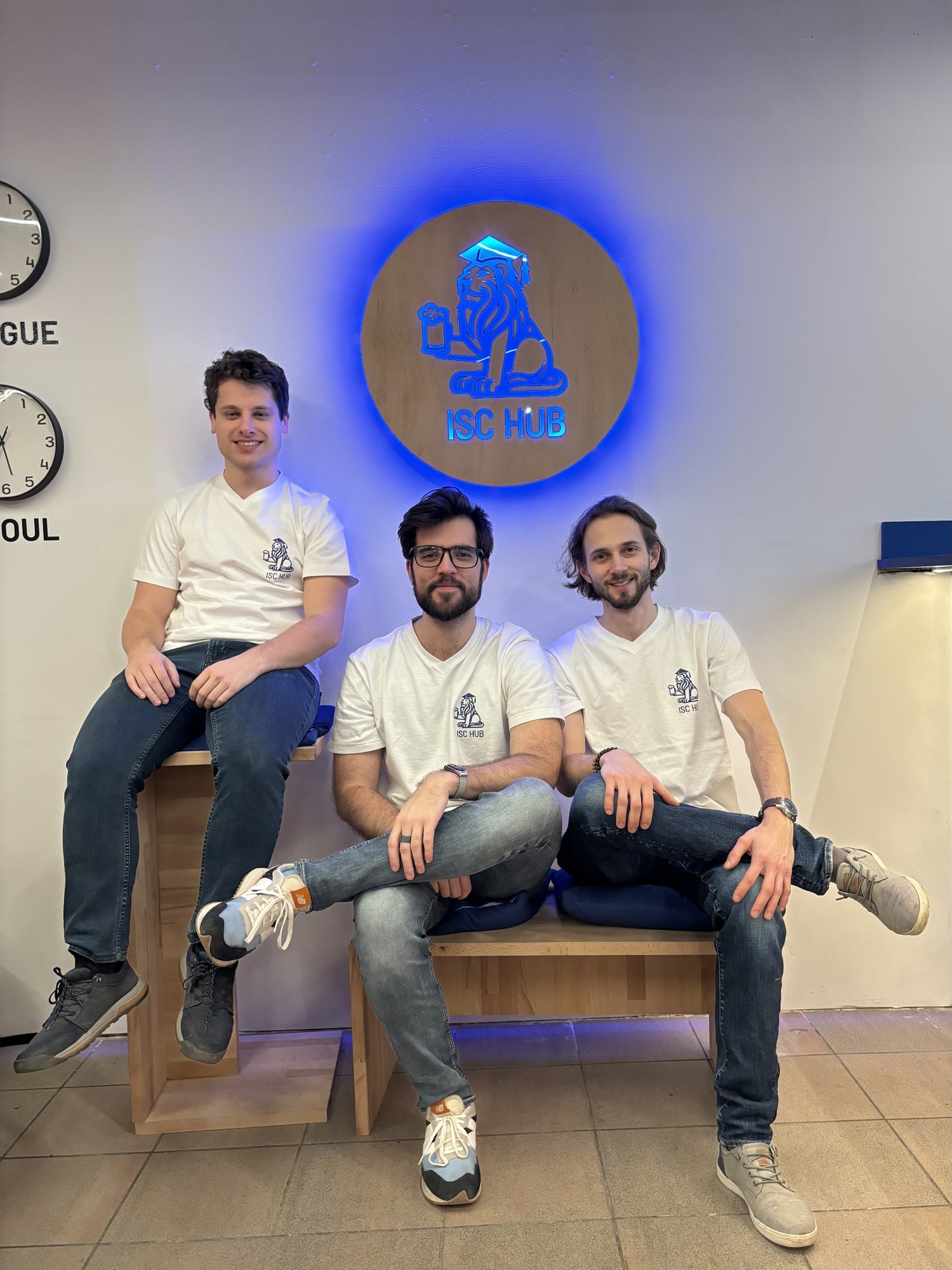 The three owners of ISC HUB sitting on benches they built themselves